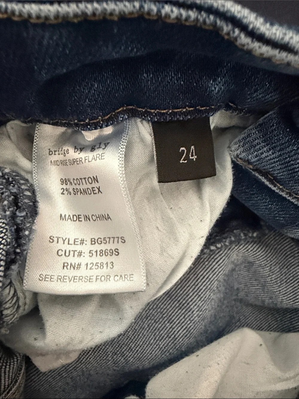 Distressed Dark Blue Flare Jeans with Ripped Detail